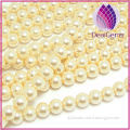 Bead glass pearl light yellow 12mm round.